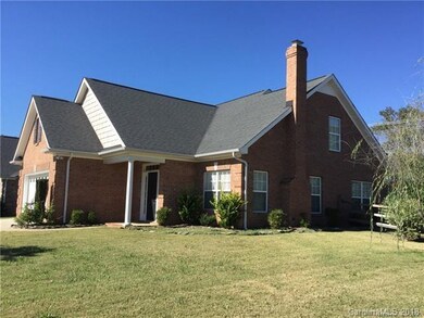 This 1.5 story full brick homes sits on a corner l
