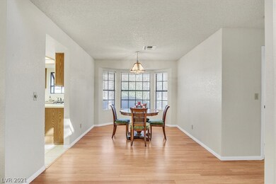 Formal dining room with bay window.