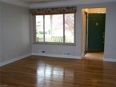 Living room with newly refinished hardwood floors!