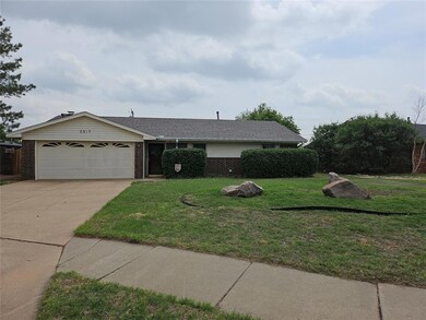 Ranch-style home with a front yard, concrete drive
