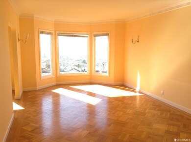 Another view of the living room with bay windows c