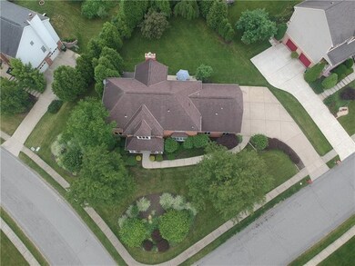 Drone view shows full lot surrounding home.
