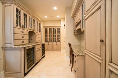 Butler Pantry featuring ample storage and built in china cabinet.