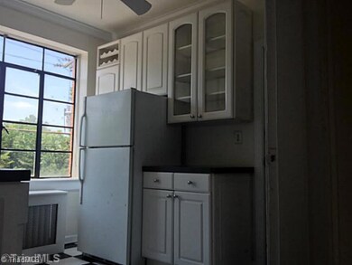 Kitchen. Large window in kitchen fills the room with natural sunlight, brightening the airy space!