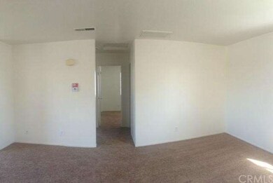 Living room looking into hall leading to bedroom 1