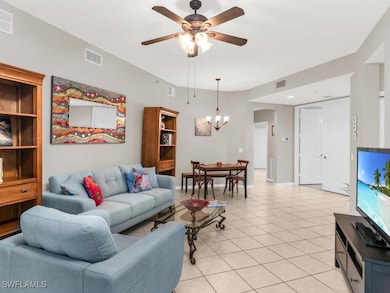 Living room featuring light tile patterned floorin