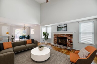 TWO-STORY GREAT ROOM FEATURES GAS FIREPLACE