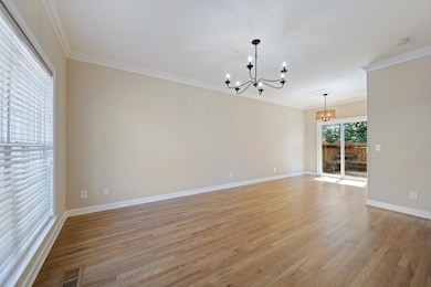 Spacious living room/dining area with gorgeous refinished sand & finish hardwood flooring throughout the main level.