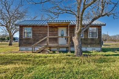 View of front of property with a front lawn and me
