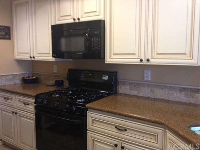 Kitchen with a lot of cabinets.  
