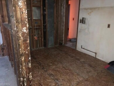 Kitchen view to entery for livingroom and hall to 