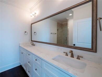 Mater bath has double sink vanity and plenty of ca