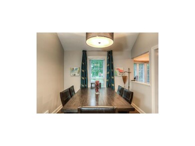 Nicely updated dining room has new hardwood floors