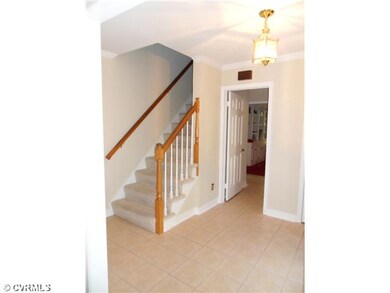 Foyer - Elegant foyer with ceramic tile and side s