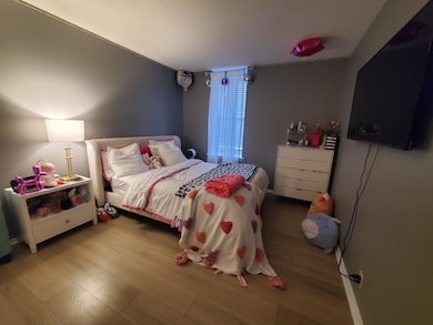 Bedroom featuring wood finished floors