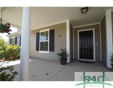 Exterior Front. Front porch with room for the rock
