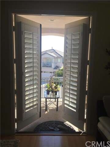 DOUBLE DOOR OPEN TO BALCONY FROM  LIVING ROOM