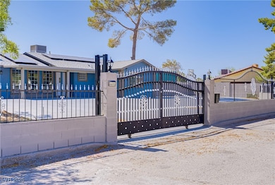 Gate featuring a fenced front yard and solar panel