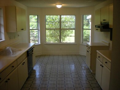 Kitchen with refurbished counters, freshly painted