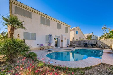View of swimming pool featuring a fenced backyard, a patio, and a pool with connected hot tub