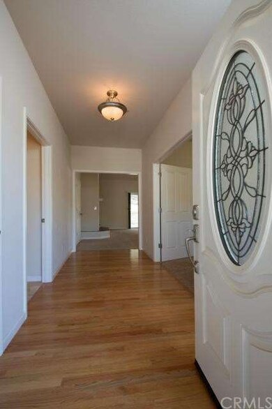 Formal entry with hardwood floors