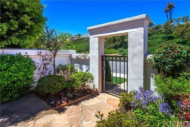 Gated, private courtyard welcomes you into this pe