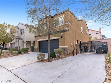 View of front facade featuring driveway, stone sid