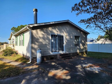 Rear view of property featuring a patio area