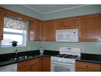 Cafeteria/Kitchen. Kitchen features granite counte