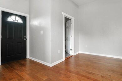 BACK ENTRY SECOND VIEW.  BEAUTIFUL HARDWOOD FLOORS