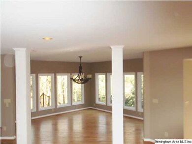 VERY OPEN LIVING ROOM AND FORMAL DINING ROOM.