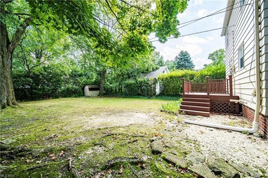 View of yard featuring an outdoor structure and wo