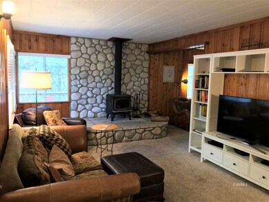 Warm, cozy living room from entry