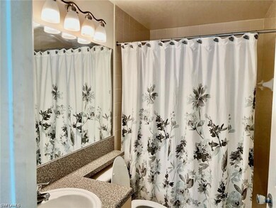 Full bath featuring a shower with shower curtain and vanity