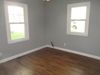 Bedrooms feature corner windows and hardwood floor