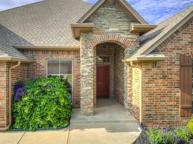 View of exterior entry with roof with shingles and