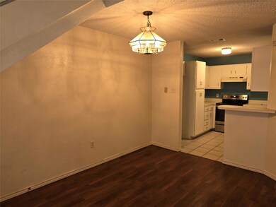 Dining open to kitchen. Luxury vinyl plank and cer