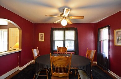 Hardwood flooring underscores the formal dining ro