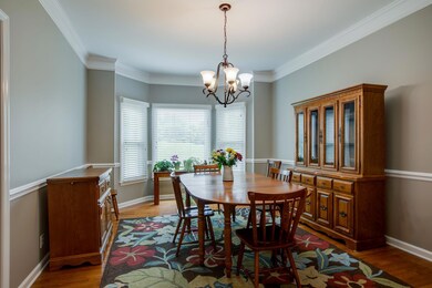 Dining area spills into the living space and kitchen. Sunny bay allows abundant light into the first level of this home! 