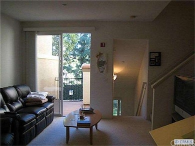 Second floor living room looking out towards green