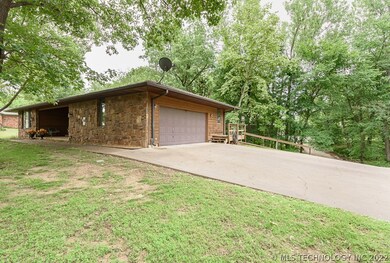 West side of home, with walk around decking to bac