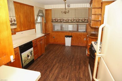 Good sized eat in kitchen with original wood panel