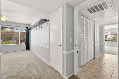 Hall with carpet flooring and healthy amount of na