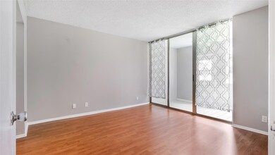 Spacious master bedroom with laminate flooring, im