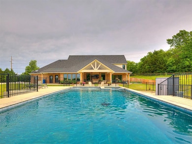 View of swimming pool with fence and a patio