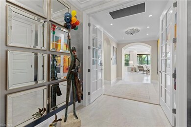 Foyer with visible vents, crown molding, baseboard
