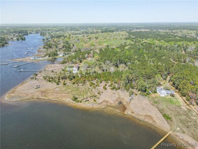 Drone / aerial view featuring a water view and a forest view
