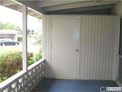 Covered porch with built-in storage cabinet