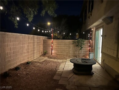 Patio at twilight featuring a fenced backyard and