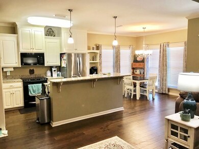 Open floorplan opens to covered rear porch